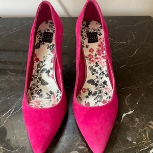 Fuchsia suede pumps.